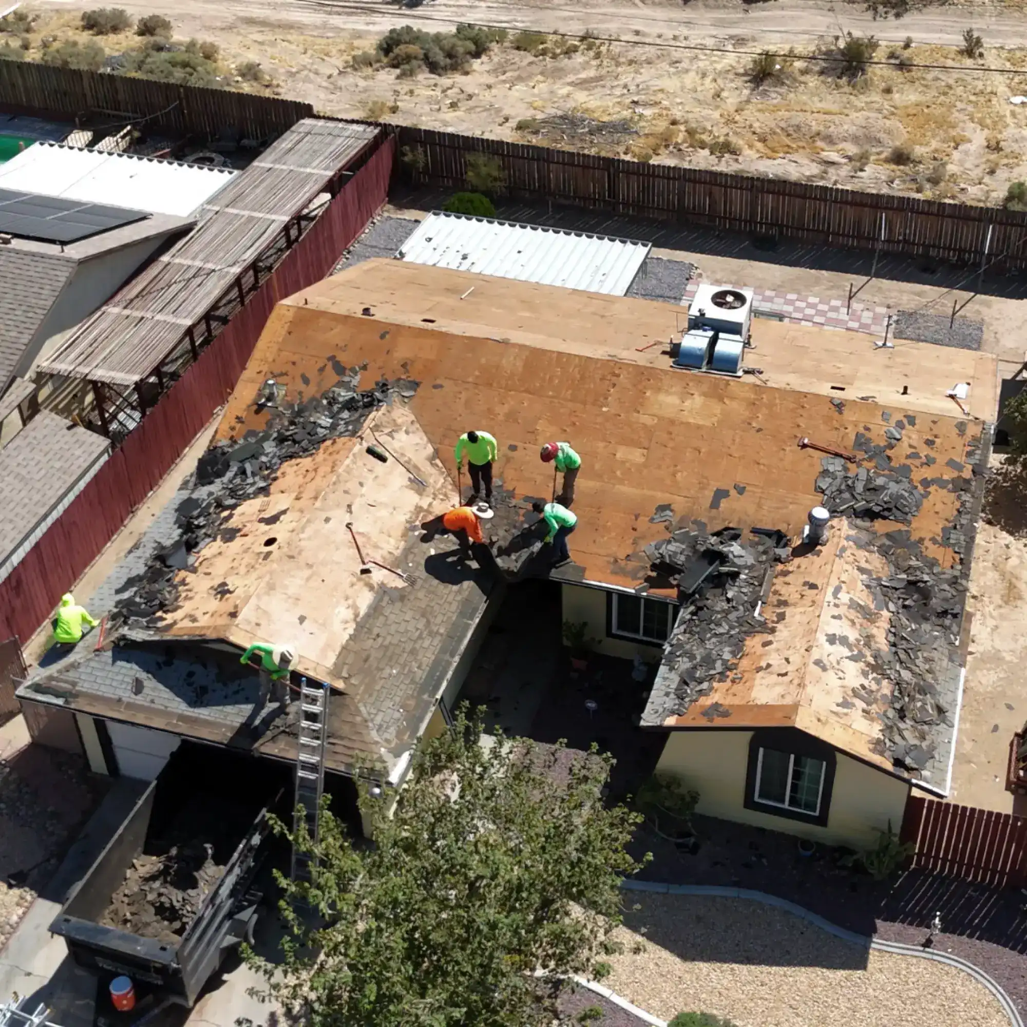 Worn residential roof before replacement