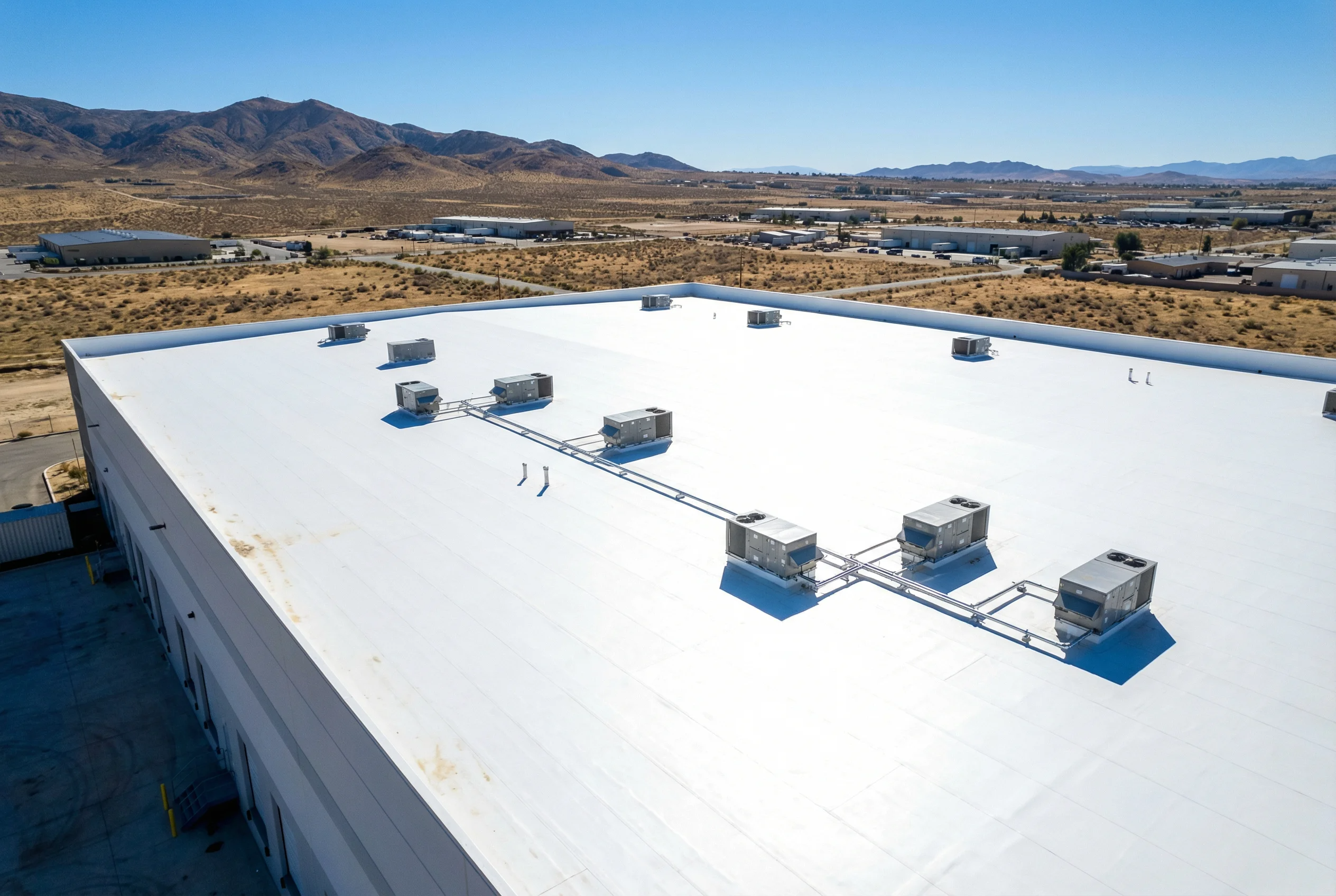 Reflective cool roof coating on a commercial building